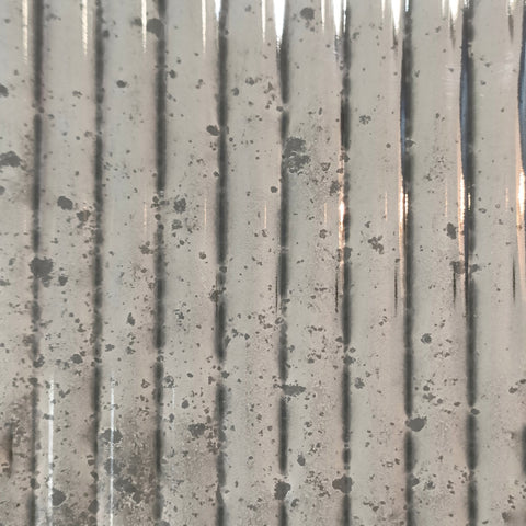 Our Fluted glass, hand silvered in our Vintage antiqued finish, other levels of distressing can be specified. The pattern repeat is approximately 12mm.