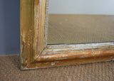 Late 19th Century French Gilt Mirror with Warm Red Bole Under