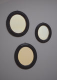 Trio of Ebonised Oval Mirrors